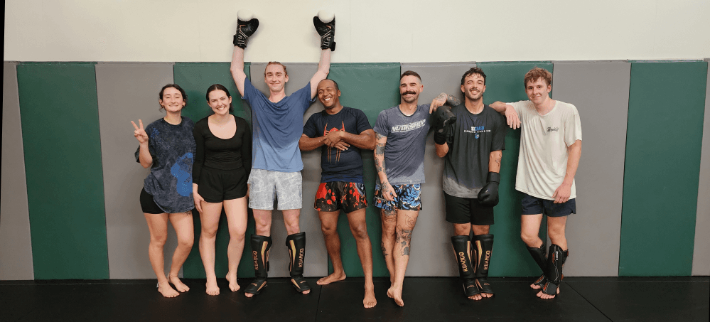 hero image of gym members posing against a wall